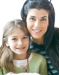 smiling mother and daughter with braces